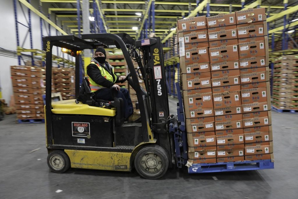 Forklift moving a pallet of goods